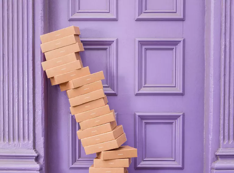 boxes-leaning-against-a-purple-door