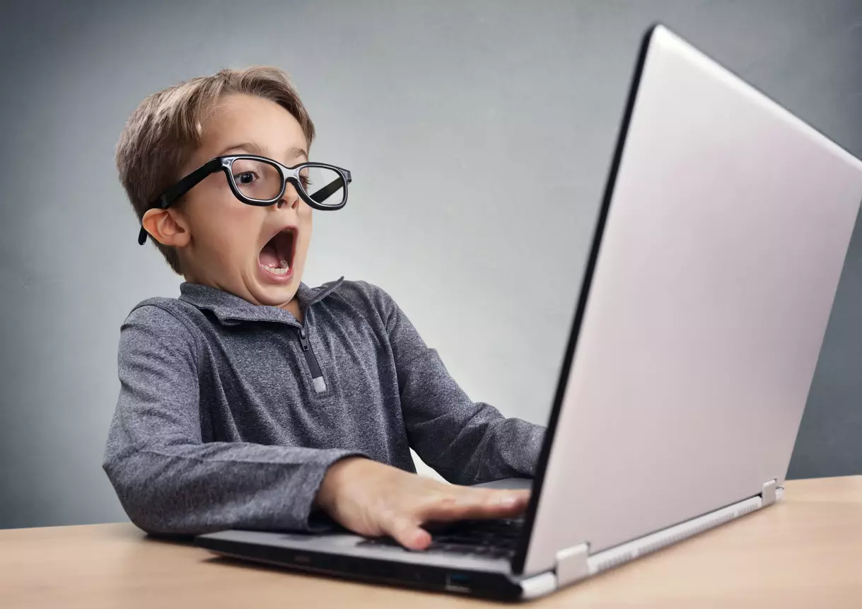 Shocked-and-surprised-boy-on-the-internet-with-laptop-computer