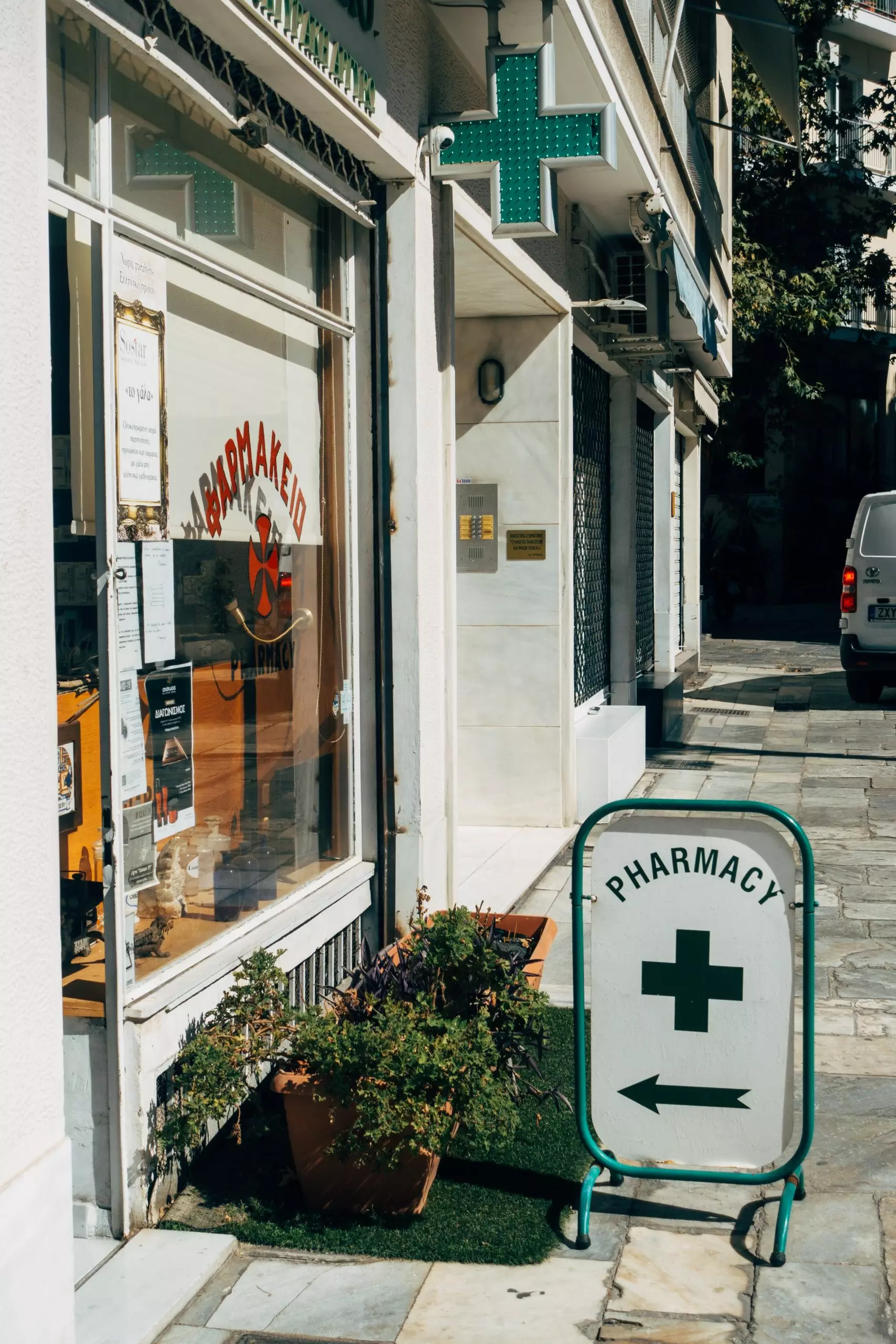 pharmacy-on-a-little-street-with-green-sign-out-the-front
