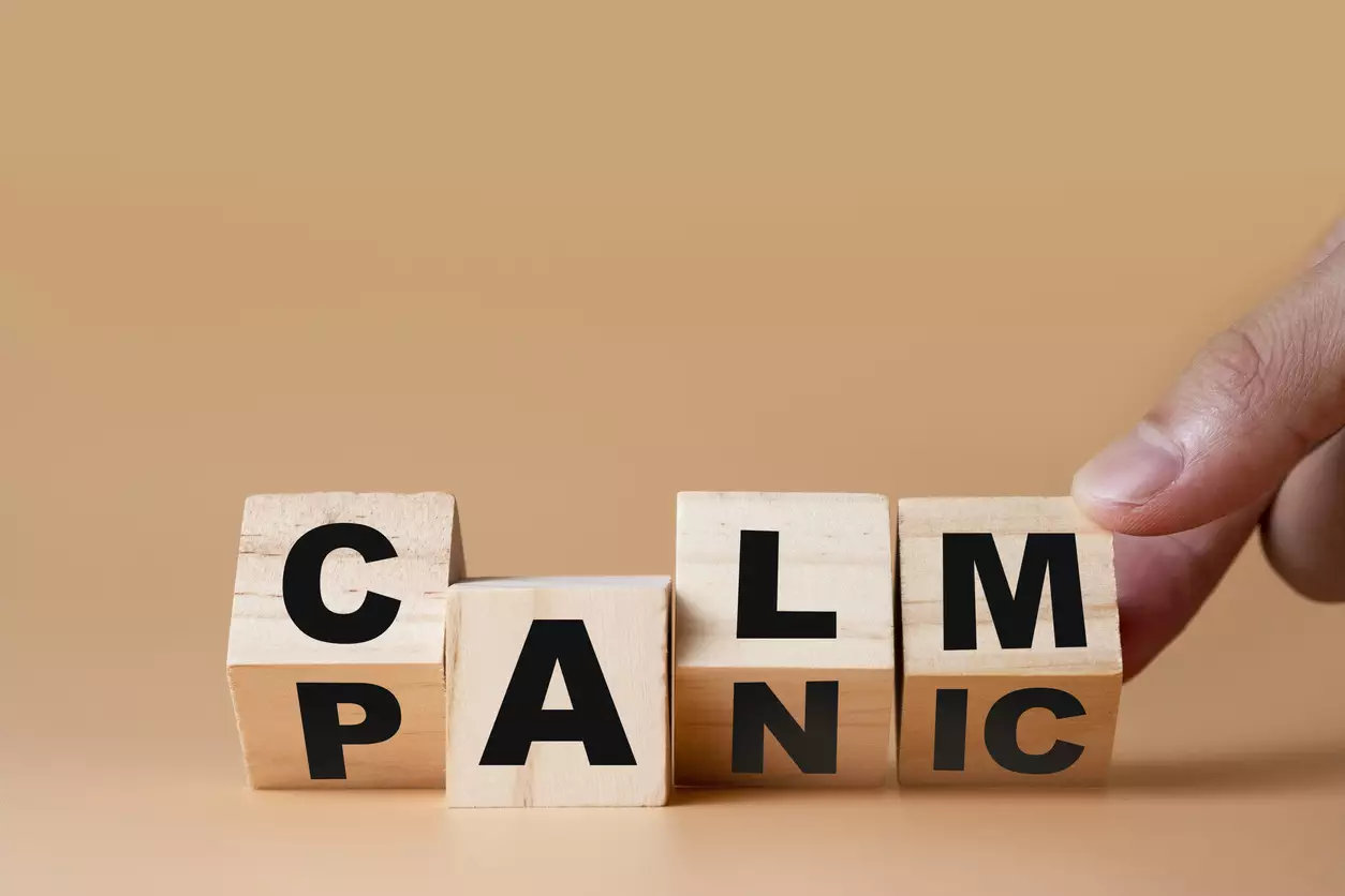 Hand-flipping-wooden-cubes-for-change-wording-"Panic"-to-"Calm"-Mindset-is-important-for-human-development.