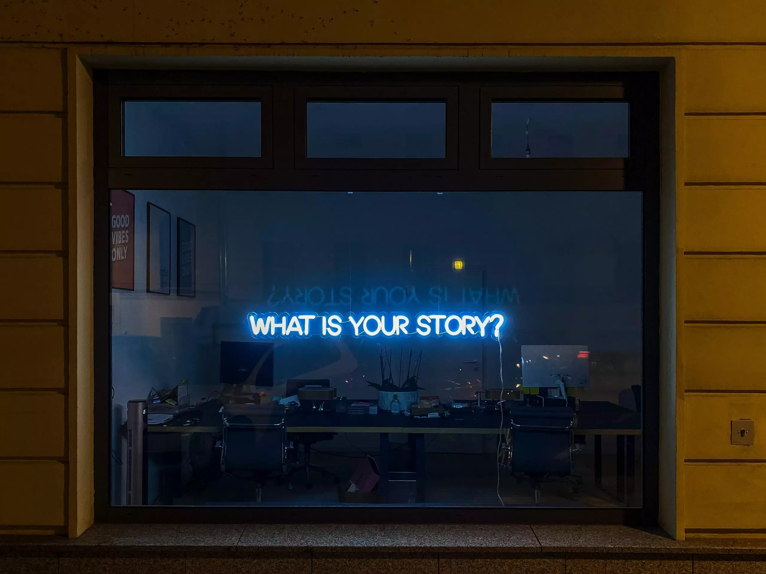 what-is-your-story-neon-lights-in-window